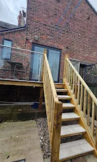 Raised exterior timber deck with newly constructed staircase