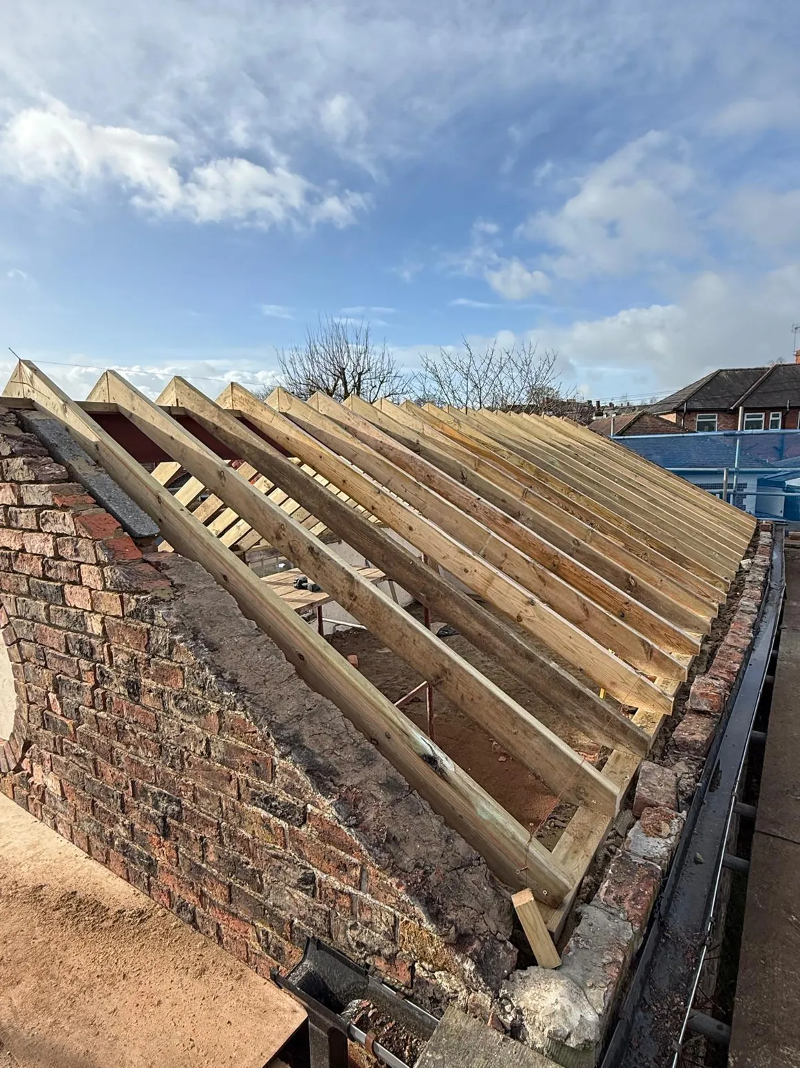 Exposed timber rafters during new roof construction